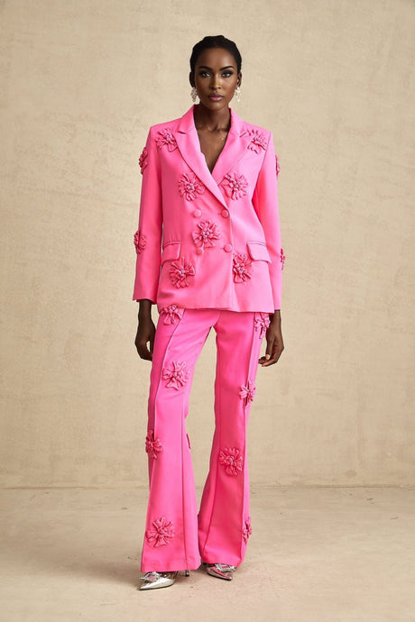 Young girl wearing pink floral jacket and matching trousers set named AmelieRose