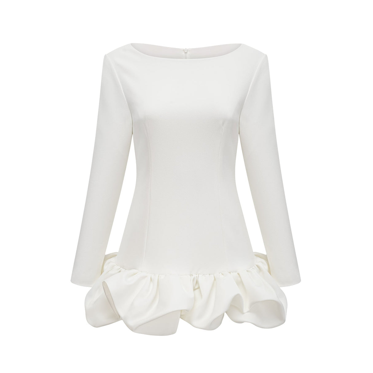 Young woman wearing a white mini dress with a bubble skirt and short sleeves standing against a plain background