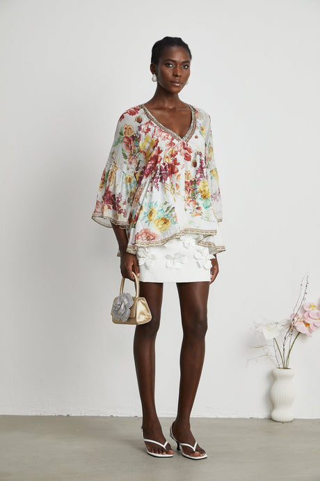Yvonne Vneck floralprint embellished blouse